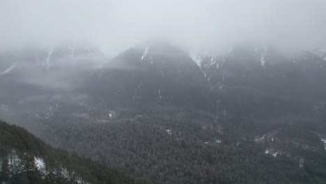 4k drone footage of mountains covered in fog