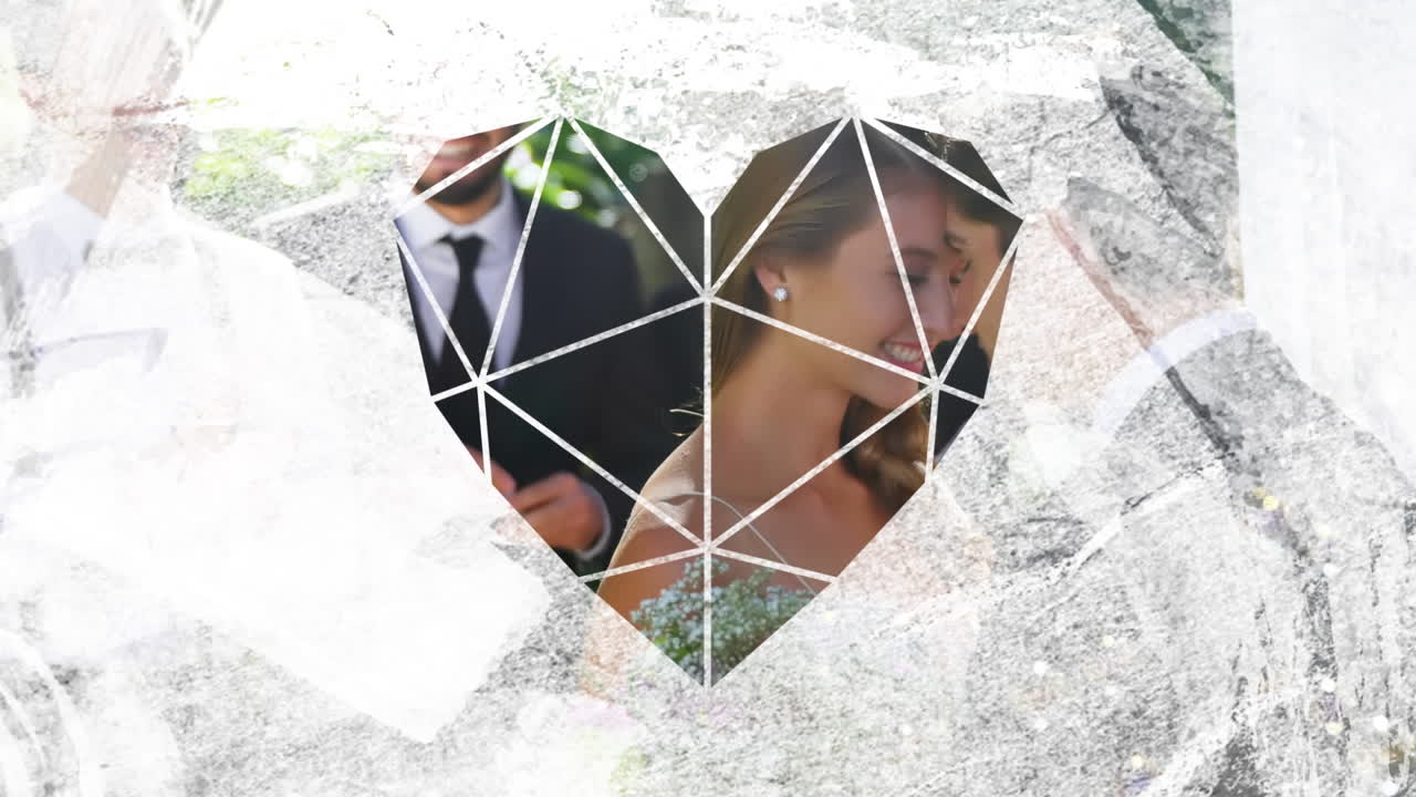 결혼한 백인 커플이 포옹하는 심장 프레임의 애니메이션