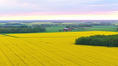 aerial orbital flight over rural farmland. pov from second drone camera