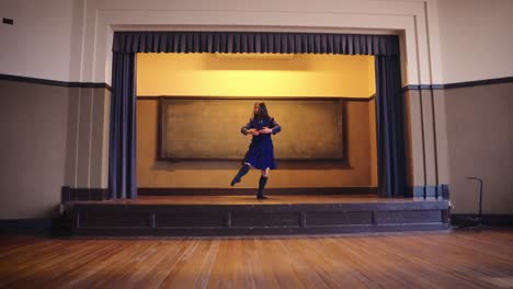 japanese girl in school uniform performs ballet in slow motion shot