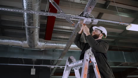 electrician installing ceiling lights