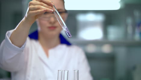 woman scientist working on chemical analysis. chemical liquid analysis