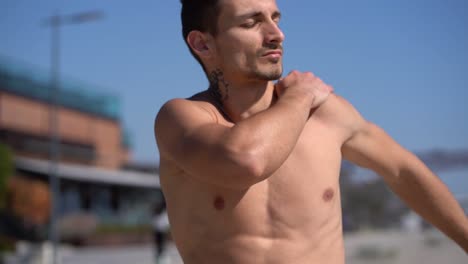 bare-chested sportsman with closed eyes training outdoor