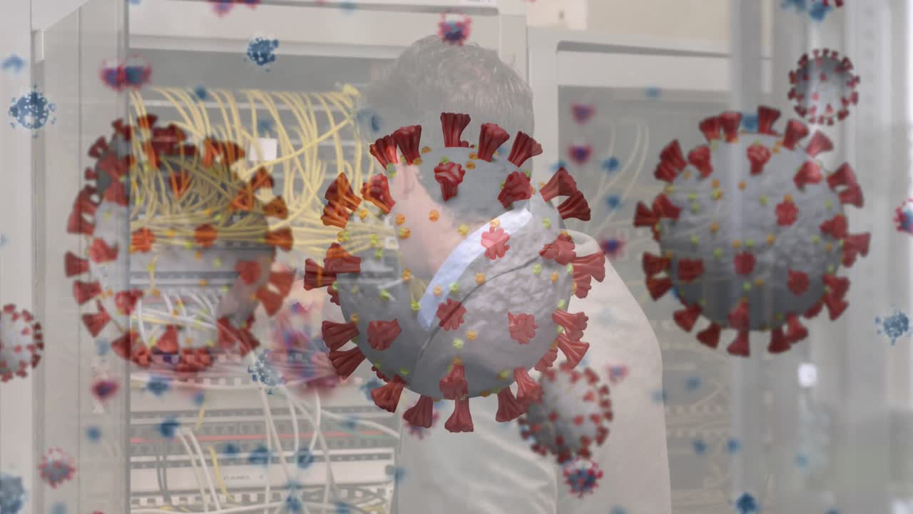 Animation of covid cells and warning text over businesswoman on laptop video call