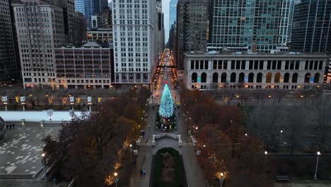 static aerial view of a christmas tree in millennium park, gloomy, winter evening in chicago, usa