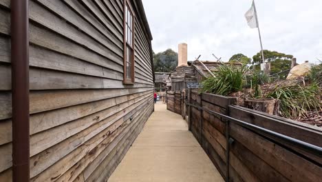 walking through historic wooden buildings and signs