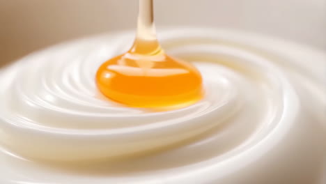 Honey Dripping into Swirled Cream or Yogurt