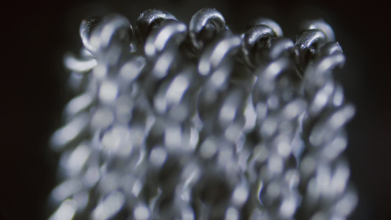 Vape RDA coil, mesh close-up under microscope