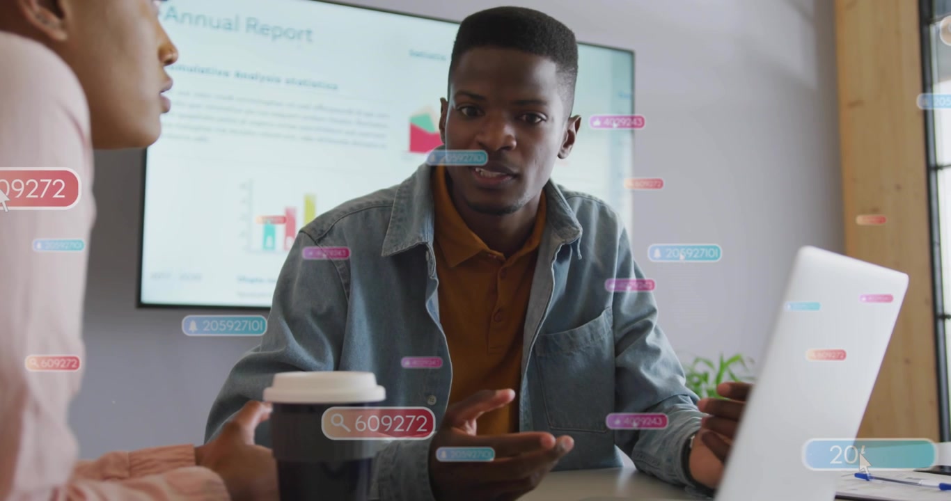 African American Business Colleagues Discussing Data with Digital Overlays