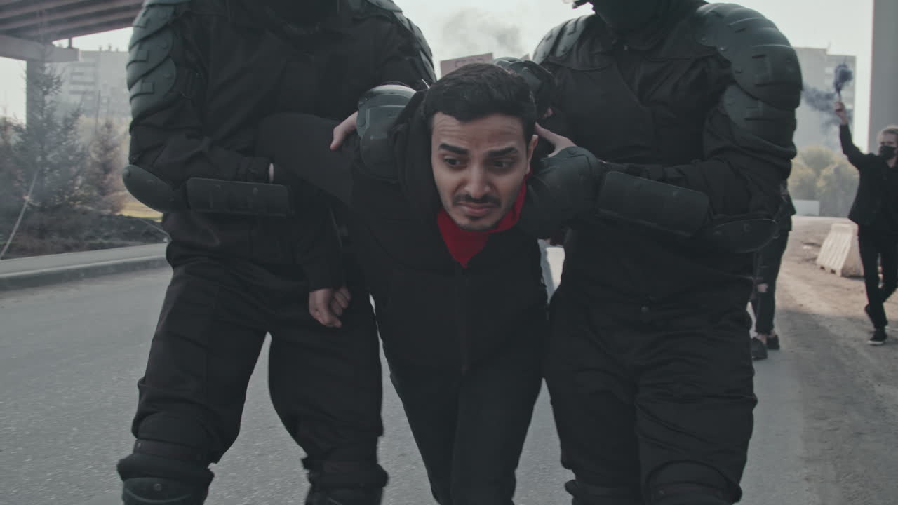 Police Arresting Protesters During a Riot