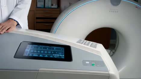 medical professional interacting with mri machine