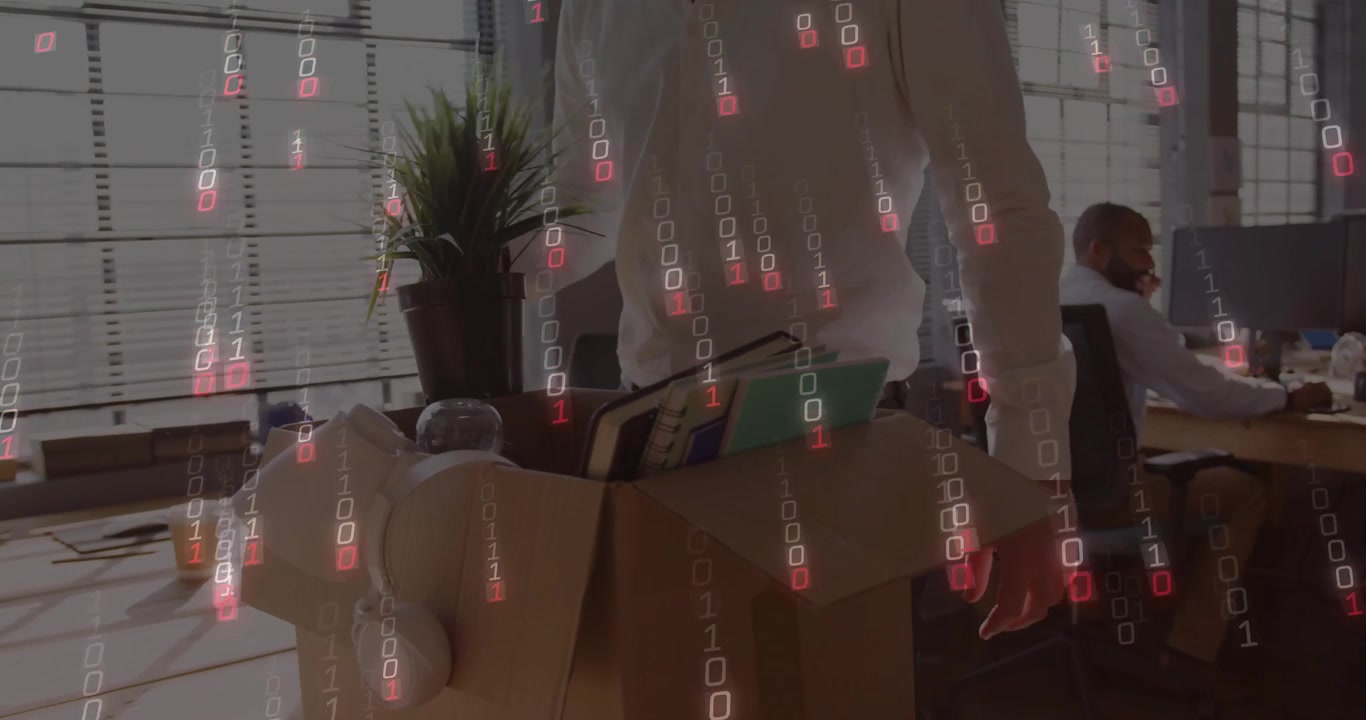 Businessman Packing Personal Belongings into Cardboard Box in Office