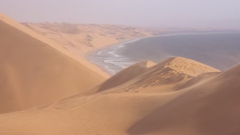 high winds blow across the amazing sand dunes of the namib desert along the skeleton coast of namibia 4