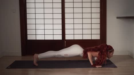 woman performing plank yoga pose