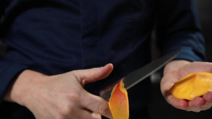Peeling a Mango/Orange