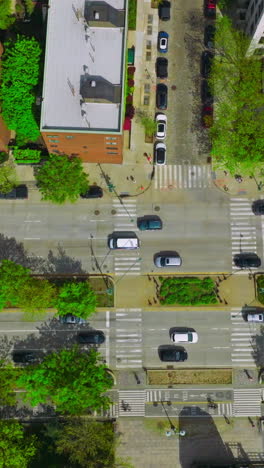 cars driving quickly over the roads of busy city. new york city traffic. aerial perspective. vertical video