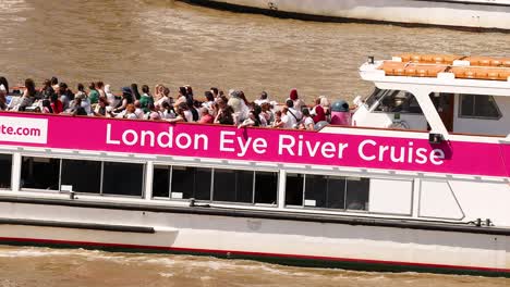 tourists enjoying a river cruise in london