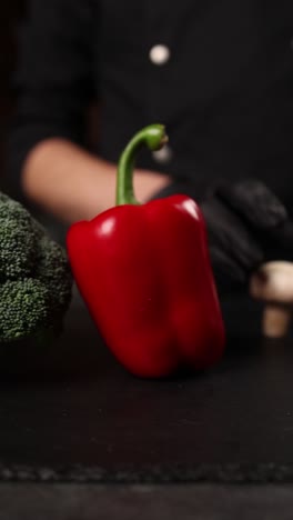 chef preparing mushrooms and peppers