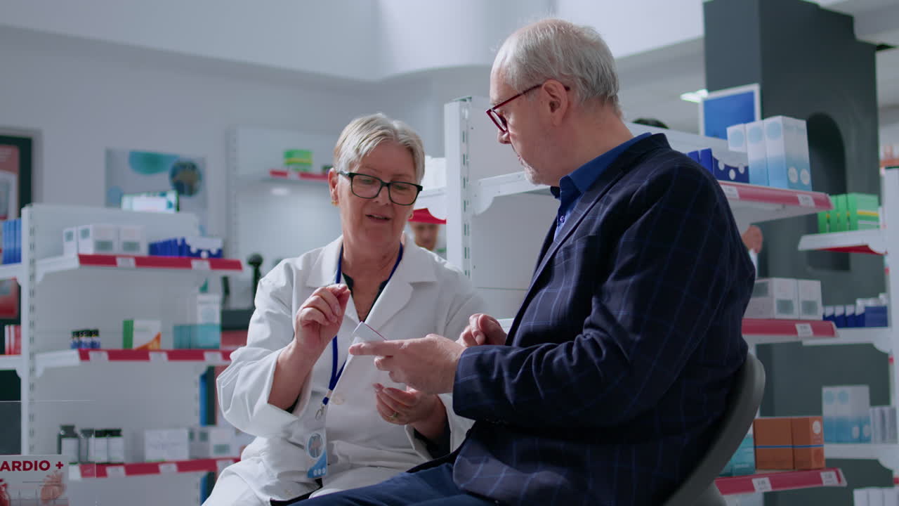 Pharmacist and elderly patient exam