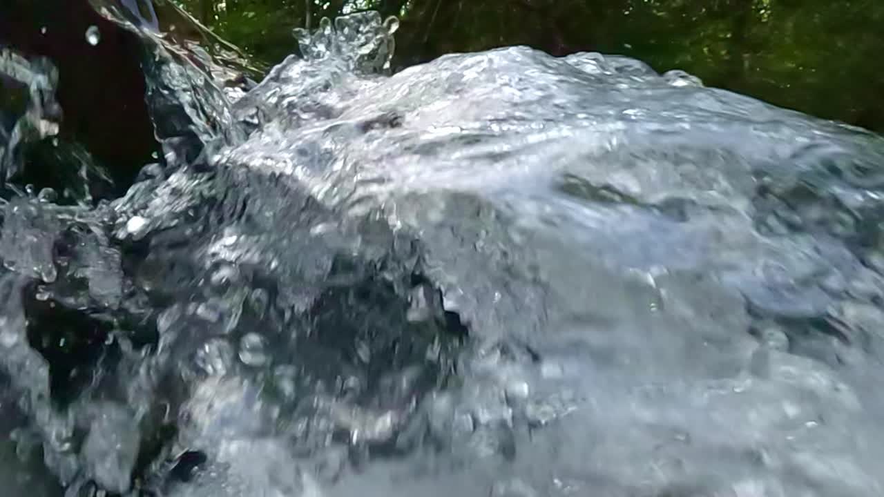 Fresh cascading river rapids, clear liquid environment, slow-mo scene