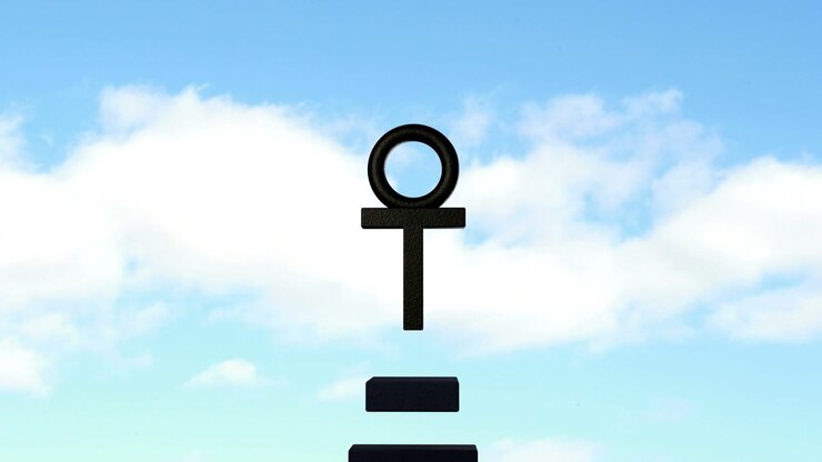 On play, lower blocks rising, aligning under T, forming symbol against blue sky with white clouds