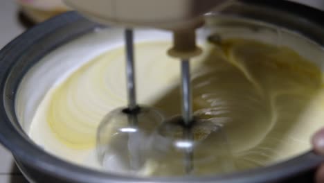 mixing cake batter with electric mixer