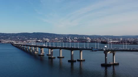 drone shot of the cars along the bay bridge in treasure island