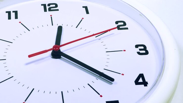 Video footage of a wall clock with twelve twenty two. Professional shot in 4K resolution
