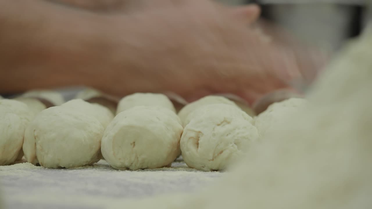 Hands Preparing Dough Balls