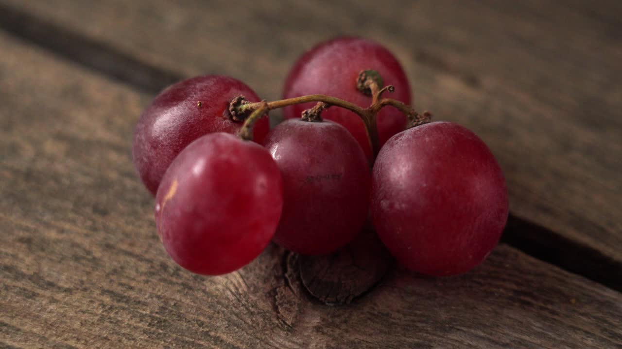 Close-up of Red Grapes on Wooden Surface