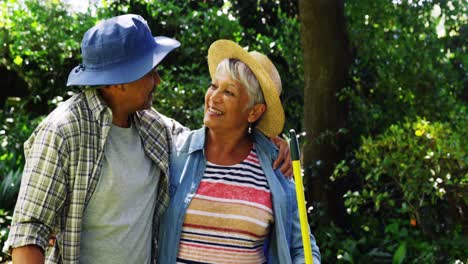 senior couple hugging each other in garden