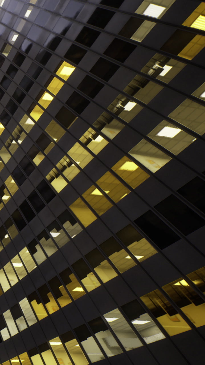 Pattern of lights in office windows at night in a tall building