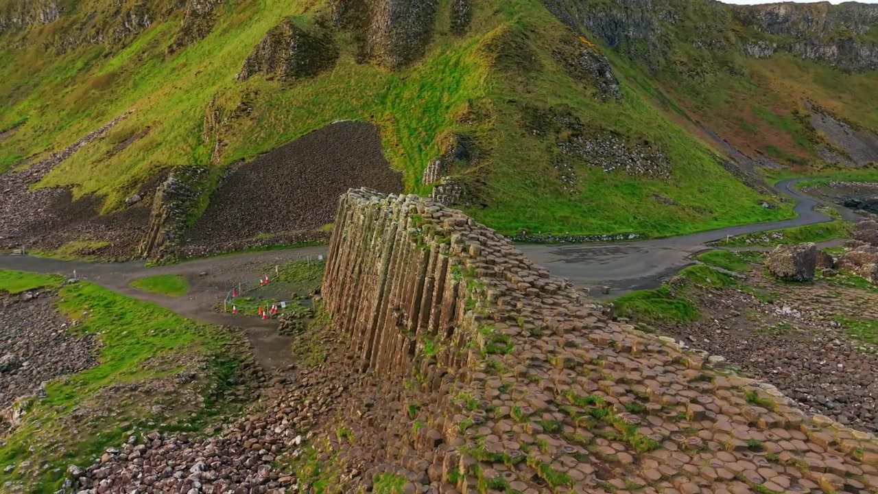 4K 60FPS aerial video of The Giant's Causeway in Bushmills, County Antrim in Northern Ireland, UK. Produced in 3840x2160 and with Rec709 color. Filmed at sunset.