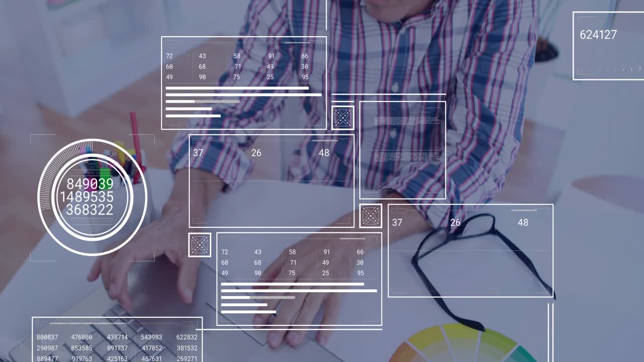 Mature adult man placing hand on trackpad and typing commands for updating animated data dashboards