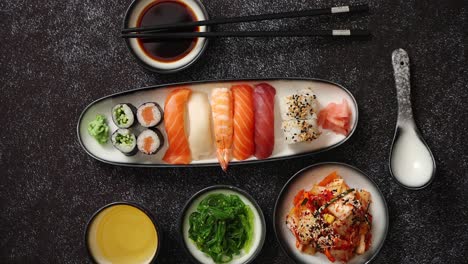 Asian-food-assortment--Various-sushi-rolls-placed-on-ceramic-plates