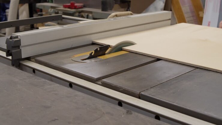 Cutting A Sheet Of Wood On A Tablesaw
