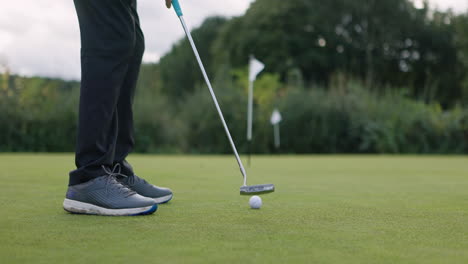 golfer putting on the green
