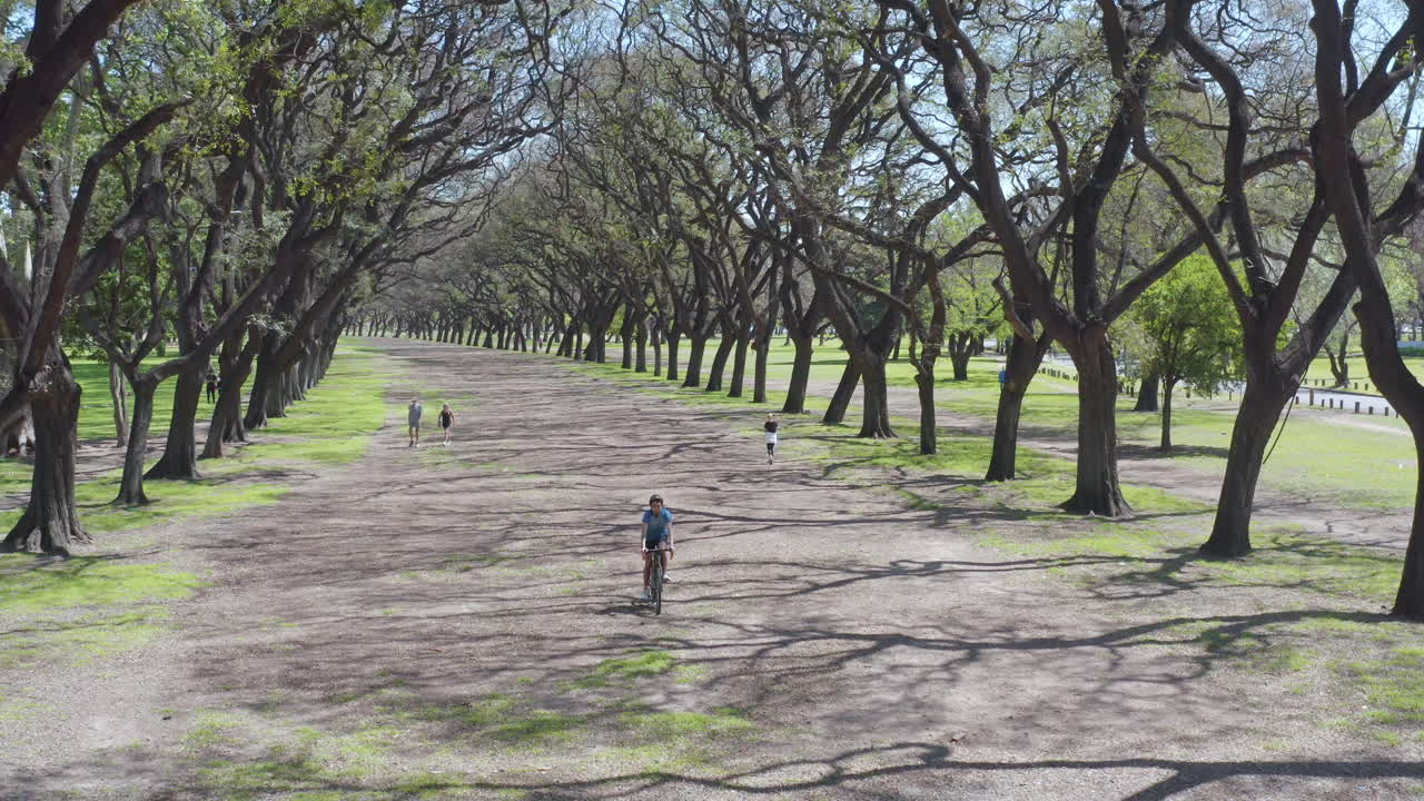 Man Having Weekend Bike Ride in the Park