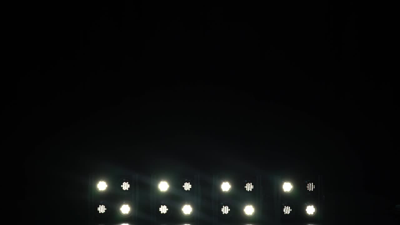 Foodlights shining brightly and turning on and off