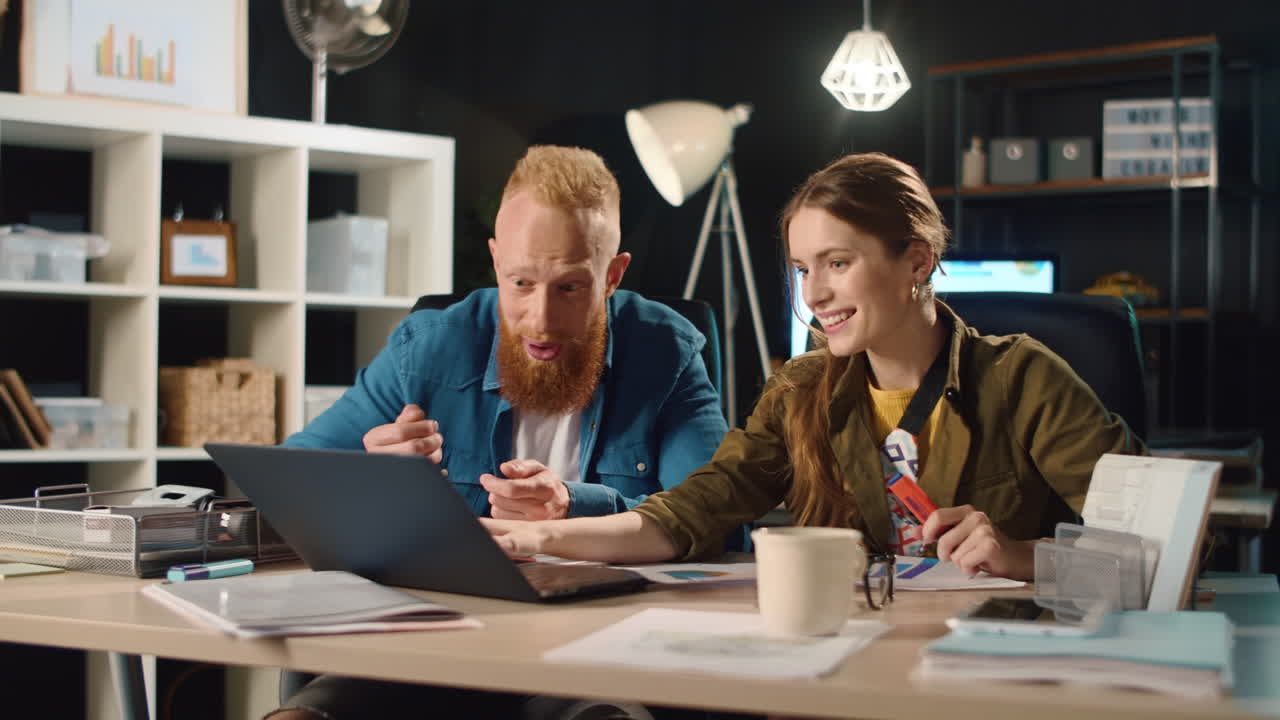 Young businesspeople working overnight