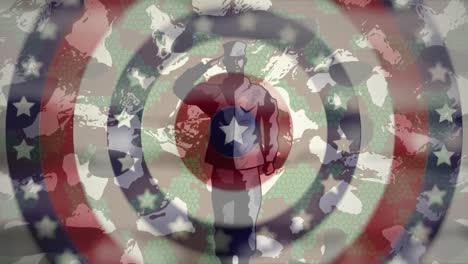 figura de soldado sobre estrellas en círculos giratorios contra el fondo de camuflaje