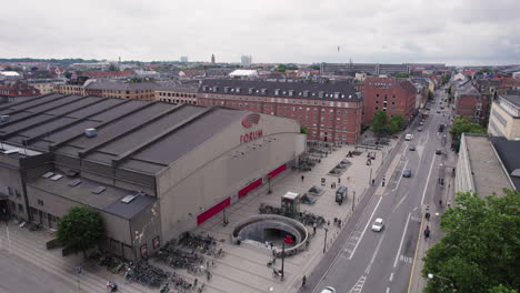 aerial view of the forum building amidst the hustle and bustle of city life, buildings, and cars