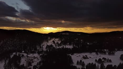 drone shot of sunset over snowy mountain