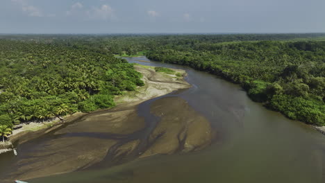 drone circling a shallow river between unique vegetation of barra san jose, mexico