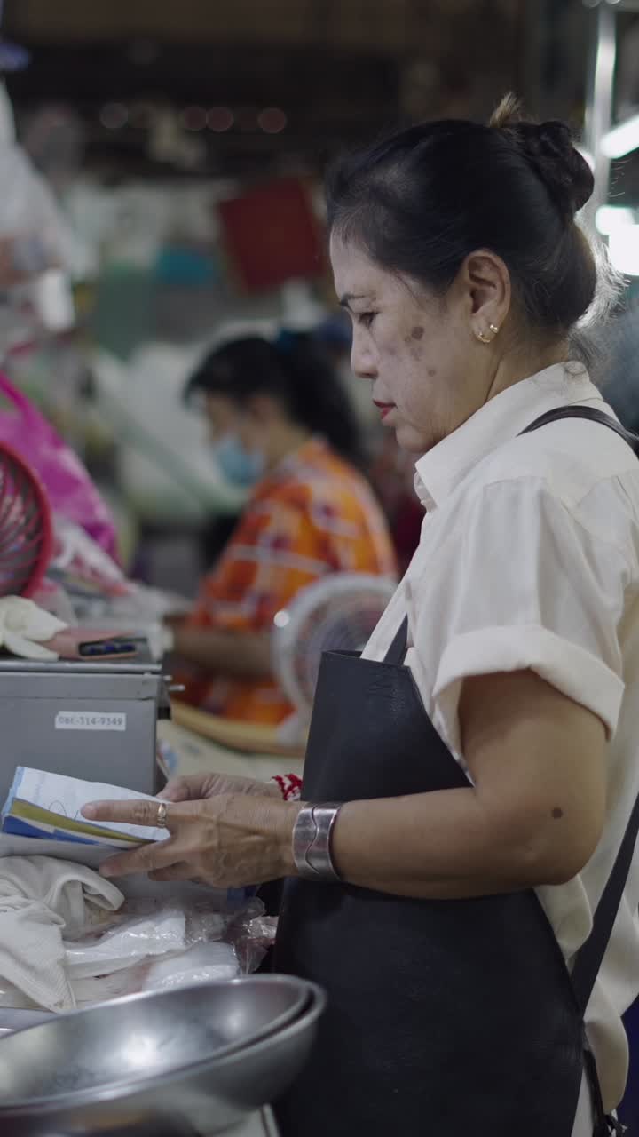 Woman in market apron