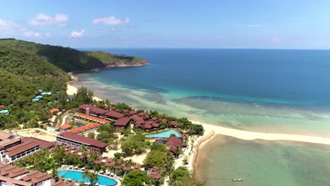 aerial view of a tropical resort on a beautiful island beach