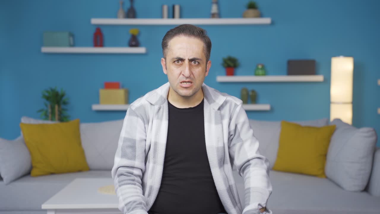 Man getting angry at camera.