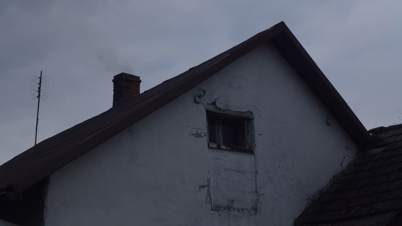 Smoke From Chimney Of Old Small Cottage House