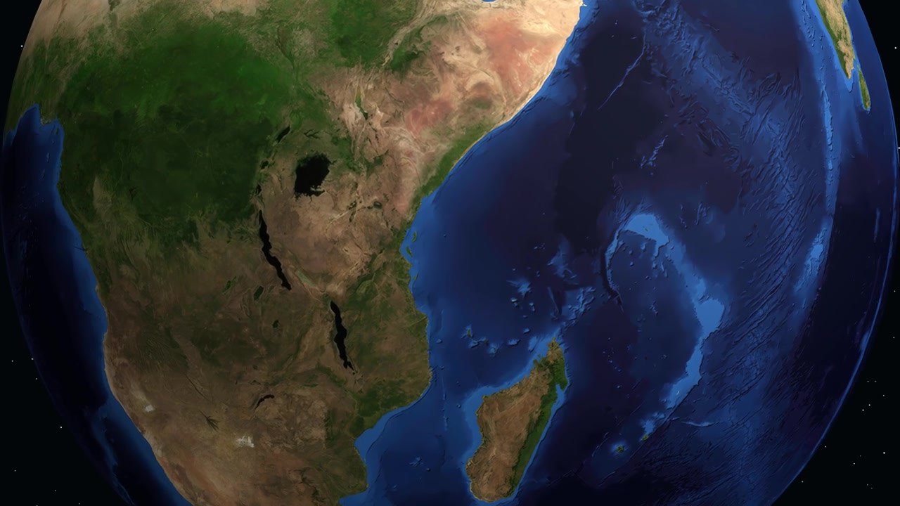 Un'animazione digitale zooma dallo spazio su Dar es Salaam, Tanzania, mostrando le coordinate geografiche.