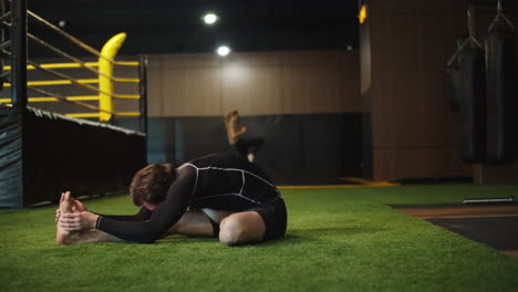 strict sport man warming up in fitness center. male boxer exercising at gym